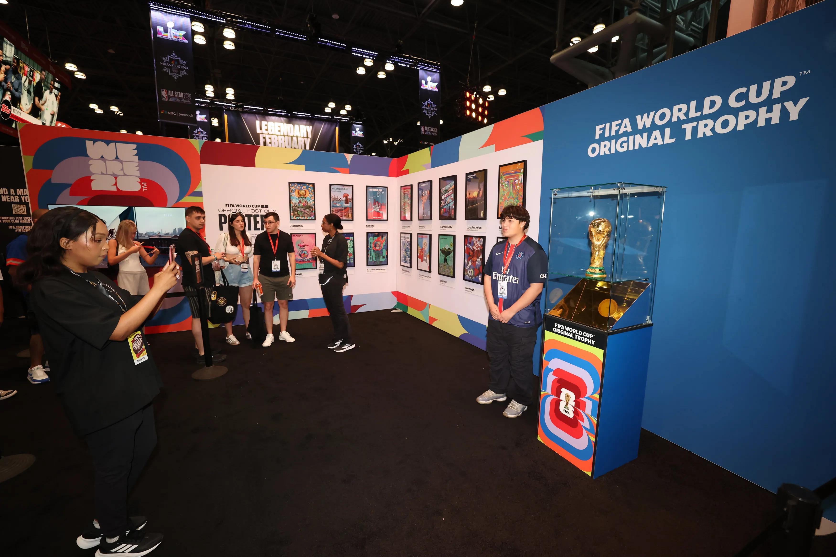 NEW YORK, UNITED STATES - JUNE 22: Fan poses with the FIFA World Cup trophy during Fanatics Fest 2025 at The Javits Center on June 22, 2025 in New York, United States. (Photo by Ira L. Black - FIFA/FIFA via Getty Images)